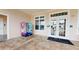 Clubhouse entrance with vending machine, tiled flooring, and double glass doors at 3238 Wish Ave, Kissimmee, FL 34747