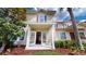 Inviting two-story townhome with double glass doors and manicured landscaping at 3238 Wish Ave, Kissimmee, FL 34747