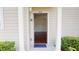 Inviting front entrance with a blue welcome mat and well-maintained landscaping at 3238 Wish Ave, Kissimmee, FL 34747