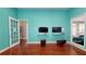Spacious game room boasts mounted TVs and comfortable seating for entertainment and relaxation at 3238 Wish Ave, Kissimmee, FL 34747