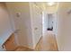 Hallway with carpet floors and white walls at 3238 Wish Ave, Kissimmee, FL 34747