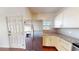 Kitchen featuring a stainless steel refrigerator and granite countertops at 3238 Wish Ave, Kissimmee, FL 34747