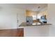 Modern kitchen with stainless steel appliances, granite countertops, and an adjacent dining area at 3238 Wish Ave, Kissimmee, FL 34747