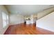 Open concept living space with hardwood floors, natural light, and access to the kitchen at 3238 Wish Ave, Kissimmee, FL 34747