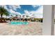 Lagoon style pool and separate spa with nearby clubhouse and lounge seating at 3238 Wish Ave, Kissimmee, FL 34747