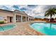 Resort-style pool with jacuzzi and spacious patio area, perfect for relaxation and entertainment at 3238 Wish Ave, Kissimmee, FL 34747