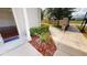 Paved walkway leading to a gated community with lush landscaping at 3238 Wish Ave, Kissimmee, FL 34747