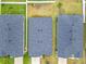 Birds eye view of three homes showing roof and lawn; neighborhood at 408 Lily Ln, Davenport, FL 33837