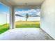 Covered porch overlooking a well-maintained backyard at 408 Lily Ln, Davenport, FL 33837