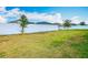 Large, grassy backyard with a white fence is perfect for outdoor activities and relaxation at 408 Lily Ln, Davenport, FL 33837
