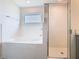 An elegant bathroom features a shower and a large soaking tub at 408 Lily Ln, Davenport, FL 33837