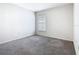 Bedroom featuring carpet flooring and a window offering natural light at 408 Lily Ln, Davenport, FL 33837