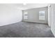 A light-filled bedroom features two windows offering natural light at 408 Lily Ln, Davenport, FL 33837