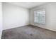 Bedroom featuring carpet flooring and a window offering natural light at 408 Lily Ln, Davenport, FL 33837