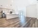 Open-concept living space connects the kitchen and living room, offering a seamless flow for entertaining at 408 Lily Ln, Davenport, FL 33837
