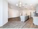 Open-concept floor plan featuring a spacious kitchen and living room, perfect for modern living and entertaining at 408 Lily Ln, Davenport, FL 33837
