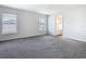 Main bedroom featuring carpet flooring and natural light, creating a peaceful retreat at 408 Lily Ln, Davenport, FL 33837