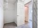 Walk-in closet with wire shelving, providing ample storage space and organization options at 408 Lily Ln, Davenport, FL 33837
