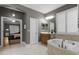 Bright bathroom with tile floors, large tub, and a view into an attached bedroom at 413 Macchi Ave, Oakland, FL 34787
