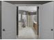 Bright bathroom featuring tile floors, double doors, and a walk-in shower at 413 Macchi Ave, Oakland, FL 34787