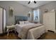 Inviting bedroom featuring a comfortable bed, stylish furnishings, and natural light from the window at 413 Macchi Ave, Oakland, FL 34787
