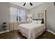 Charming bedroom with a comfortable bed, bedside table, and bright natural light at 413 Macchi Ave, Oakland, FL 34787