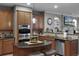 Gourmet kitchen showcasing stainless steel appliances, granite countertops, and ample counter space at 413 Macchi Ave, Oakland, FL 34787