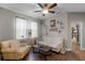 Inviting living room featuring hardwood floors and comfortable seating arrangement at 413 Macchi Ave, Oakland, FL 34787