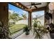 Spacious patio with lush landscaping, decorative plants, and a view of the fenced backyard at 413 Macchi Ave, Oakland, FL 34787