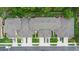 Aerial view of townhomes with manicured lawns and allocated parking spaces at 456 Harbor Winds Ct, Winter Springs, FL 32708