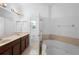 Bathroom with a double vanity, a soaking tub, and a walk-in shower at 456 Harbor Winds Ct, Winter Springs, FL 32708