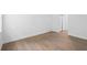 Bright bedroom with hardwood floors, base molding, and a double door closet at 456 Harbor Winds Ct, Winter Springs, FL 32708