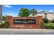 Harbor Winds brick community sign surrounded by manicured landscaping and mature palm trees at 456 Harbor Winds Ct, Winter Springs, FL 32708