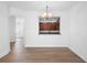 Dining room featuring hardwood floors and a chandelier at 456 Harbor Winds Ct, Winter Springs, FL 32708