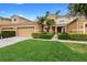 Charming two-story home with well-maintained lawn and landscaping features a large two-car garage at 456 Harbor Winds Ct, Winter Springs, FL 32708