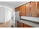 Spacious kitchen featuring wood cabinets, countertops, and a modern refrigerator at 456 Harbor Winds Ct, Winter Springs, FL 32708