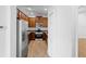 Well-equipped kitchen with stainless steel appliances, wood cabinetry, and a pantry at 456 Harbor Winds Ct, Winter Springs, FL 32708