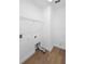 Clean laundry room with laminate flooring and shelving at 456 Harbor Winds Ct, Winter Springs, FL 32708