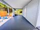 Spacious backyard with seating under covered patio, fencing and side yard access at 511 S Alder Ave, Orlando, FL 32807