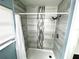 Updated shower features gray tile and modern fixtures at 511 S Alder Ave, Orlando, FL 32807