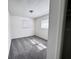 Bedroom with two windows and gray carpeting at 511 S Alder Ave, Orlando, FL 32807