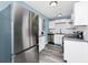 Modern kitchen with stainless steel appliances, granite countertops, and subway tile backsplash at 511 S Alder Ave, Orlando, FL 32807