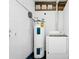 Well-lit laundry room with appliances, bright walls and rustic decorations for a welcoming feel at 511 S Alder Ave, Orlando, FL 32807