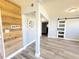 Open living space showcasing wood accent wall, gray flooring, and sliding barn door, creating a stylish and airy ambiance at 511 S Alder Ave, Orlando, FL 32807