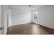 Inviting bedroom featuring wood-look floors, neutral walls, and a ceiling fan at 5156 Conroy Rd # 1124, Orlando, FL 32811