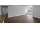 Inviting living room boasting wood-look floors, neutral walls, and lots of natural light from large windows at 5156 Conroy Rd # 1124, Orlando, FL 32811