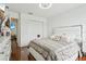 Bright bedroom with hardwood floors features a bed and a ceiling fan at 5248 Royal Point Ave, Kissimmee, FL 34746