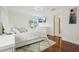 Bright bedroom features hardwood floors, a plush rug, and a flatscreen television for comfortable living at 5248 Royal Point Ave, Kissimmee, FL 34746