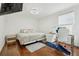 Spacious bedroom features hardwood floors, a desk and a queen size bed at 5248 Royal Point Ave, Kissimmee, FL 34746