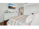 Bedroom with hardwood floors featuring a modern dresser and a closet at 5248 Royal Point Ave, Kissimmee, FL 34746
